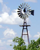 starwatcher: Western windmill, clouds in background, trees around base. (Default)