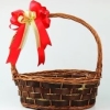 anaisonfire: An empty woven basket with a red and gold bow on the handle. (empty gift basket)