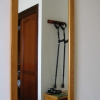 davidgillon: A pair of crutches, hanging from coat hooks, reflected in a mirror (Default)