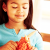 timeasmymeasure: little black girl knitting with bright orange yarn (stock: knitting girl)