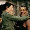 muccamukk: Vala hugging Teal'c, her legs wrapped around his waist. Both are smiling. (SG-1: Happy -hugs-)