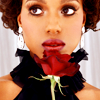 timeasmymeasure: kerry washington with a rose held right below her lips (Default)