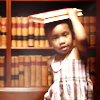 timeasmymeasure: a little girl with holding a book steady on her head (stock: girl with book on her head)