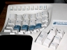 metahacker: Half of an unusual keyboard, its surface like two craters with keys within. (keys)