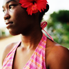 timeasmymeasure: woman with red flower in her hair, head turned to the side (stock: girl with flower in her hair)