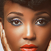 timeasmymeasure: close up on the face of a black woman looking at the camera calmly (stock: eyes)